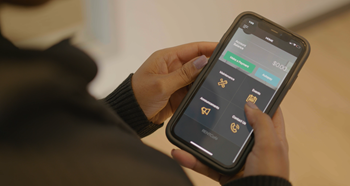 a person holding a cell phone with the settings screen on it